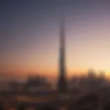 The majestic silhouette of Nastaran Tower against the Dubai skyline at sunset.